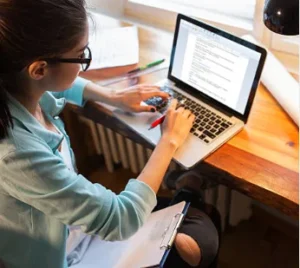 student writing email professor scholarship PhD university laptop 2026