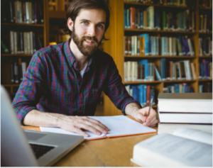 PhD student writing research proposal scholarship university library 2026