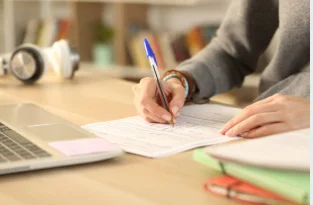 student writing personal statement university admission application desk 2026